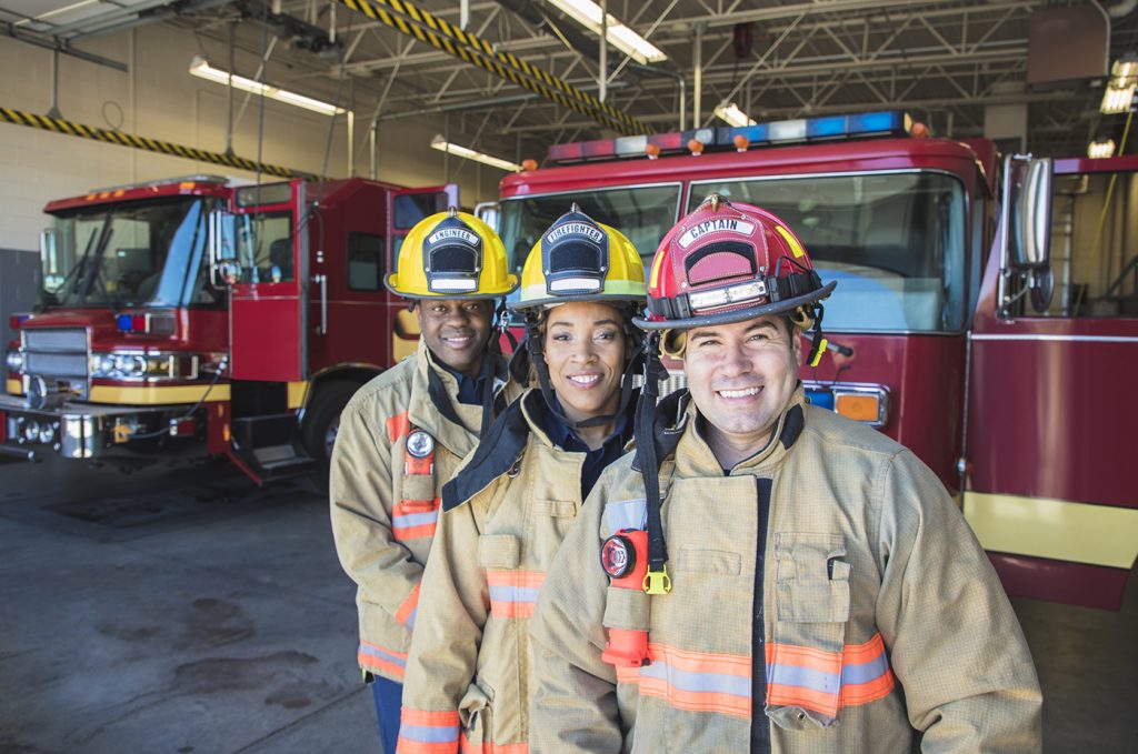 1st Responder Jobs - A stock group/team of firefighters looking into the camera.